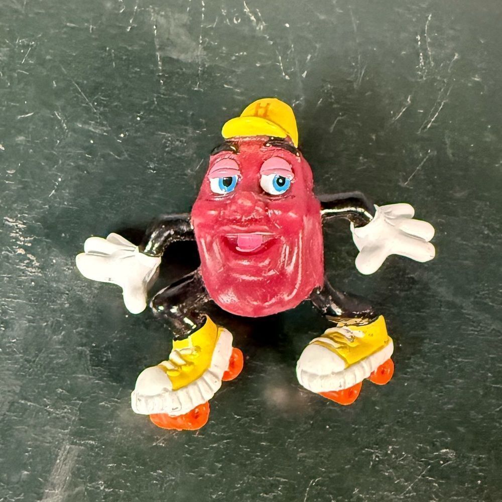 Vintage California Grapevine Raisin Roller Skater Figurine. Retired 1988